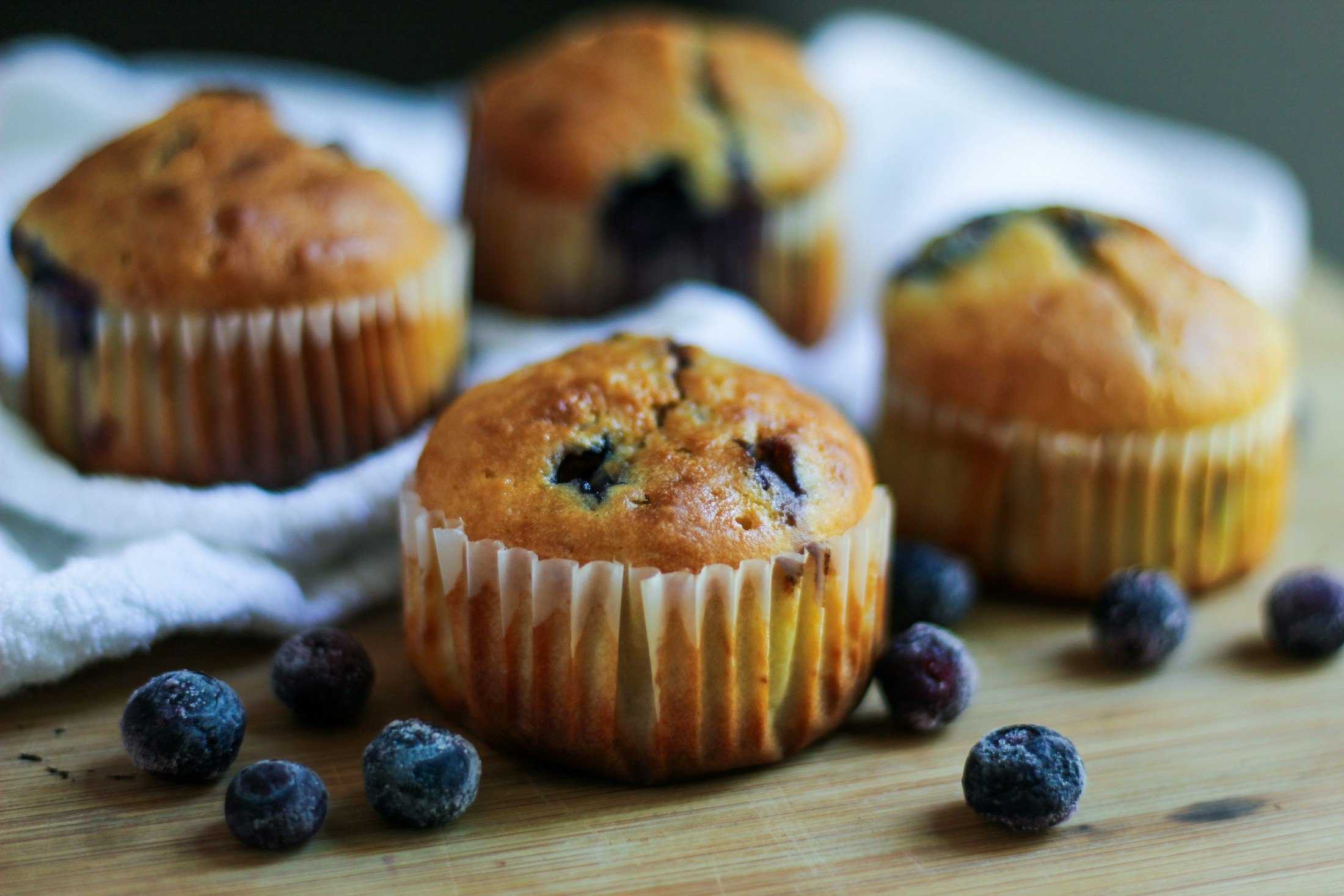 Blueberry muffins on a wooden table