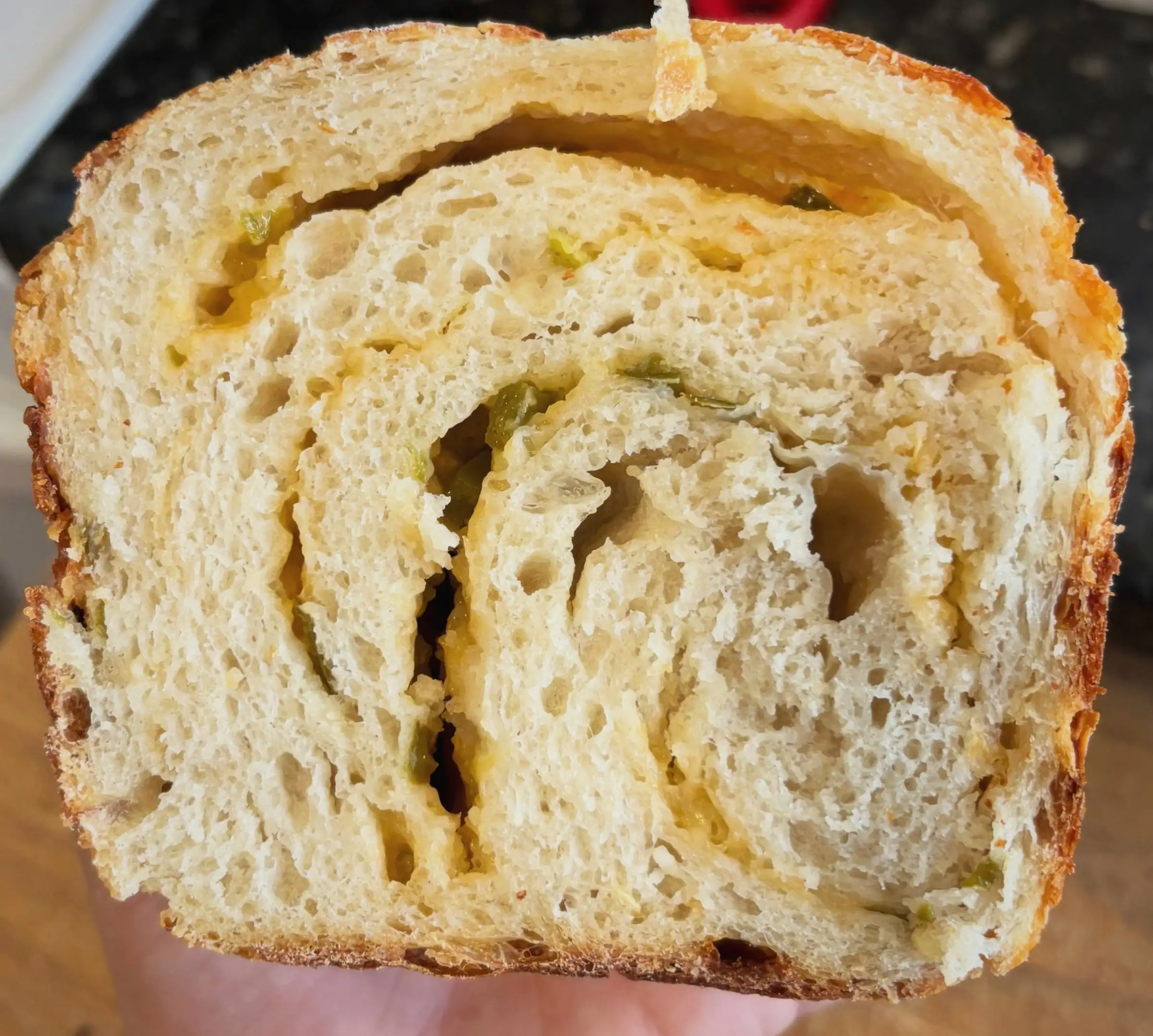 A thick slice of jalapeño cheddar swirl sourdough